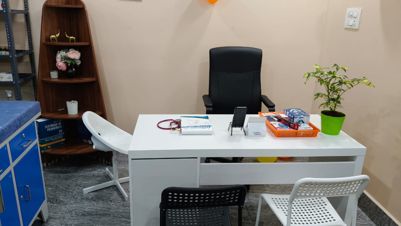 Doctor's consultation room with desk and seating