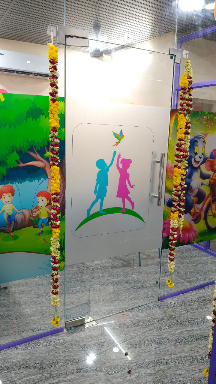 Colourful kid-themed glass entrance doors